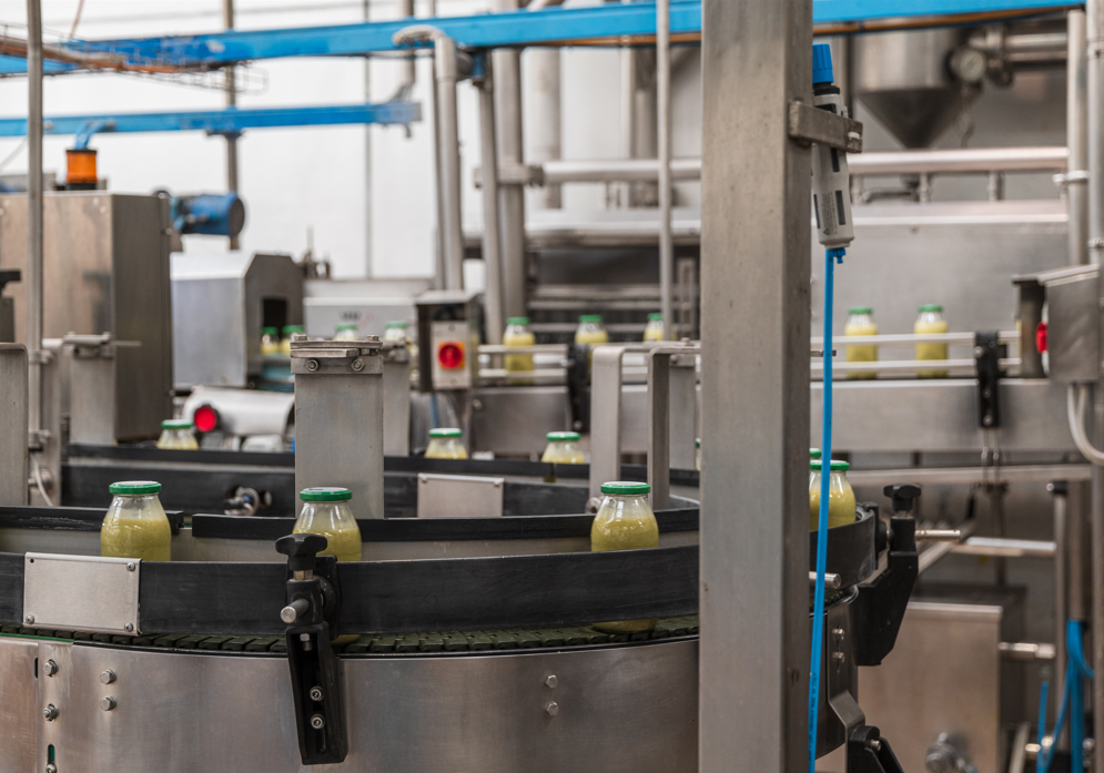 Wind turbine blades against a landscape.