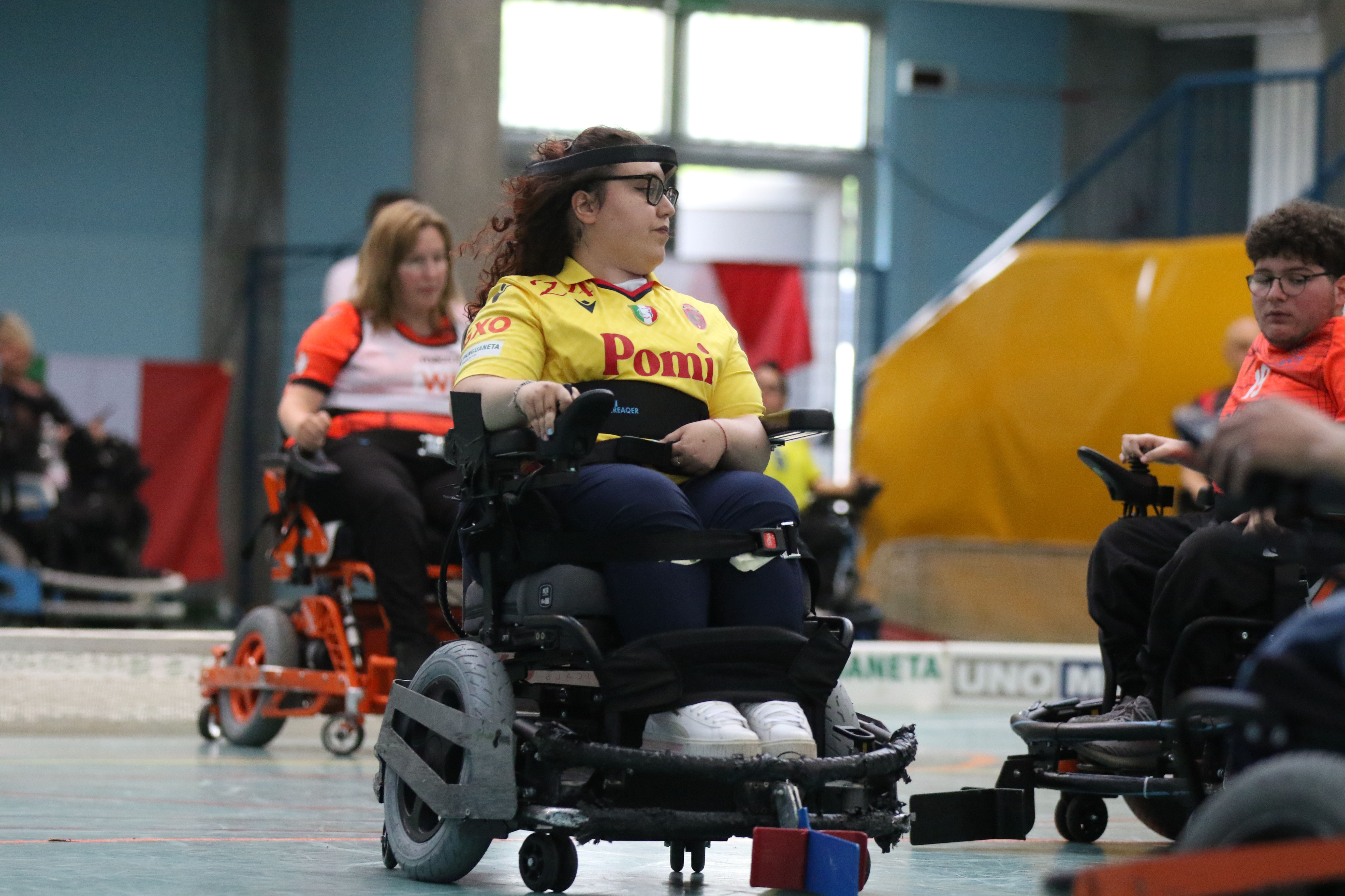 Wind turbine blades against a landscape.
