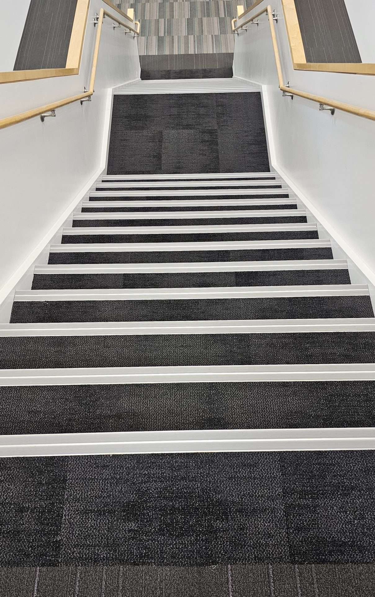 Küberit stair nosing installed on a commercial staircase