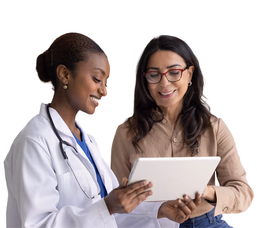 Female doctor in white lab coat holding folders and a tablet, smiling and looking to the side.