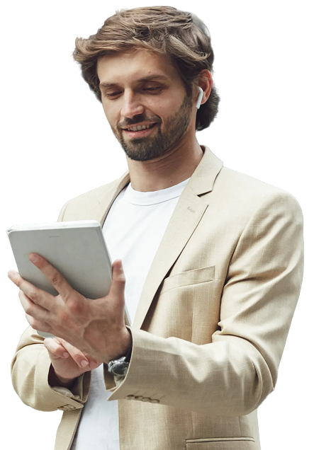 Female doctor in white lab coat holding folders and a tablet, smiling and looking to the side.