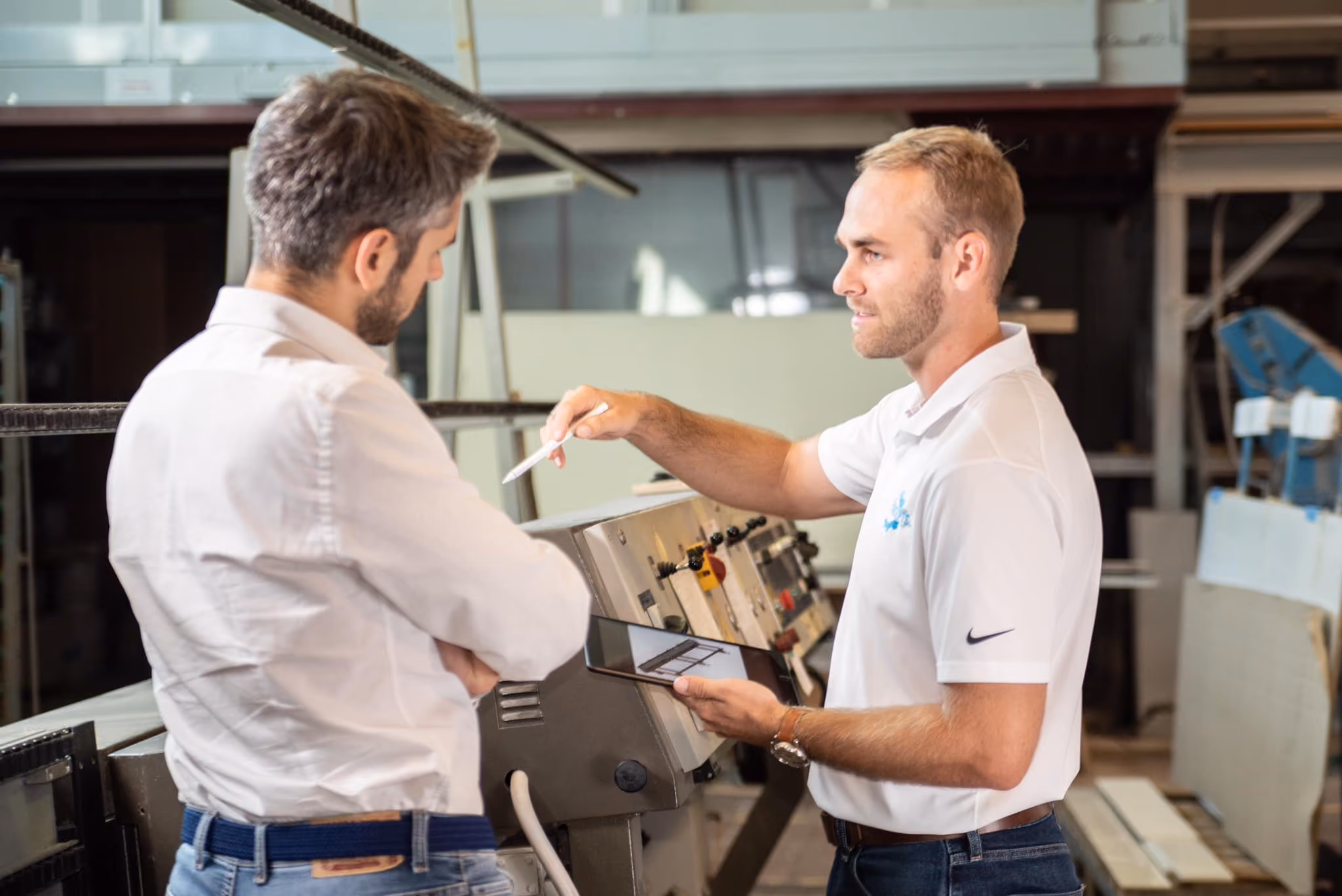 ProConcepts technician demonstrating a machine control panel to a client