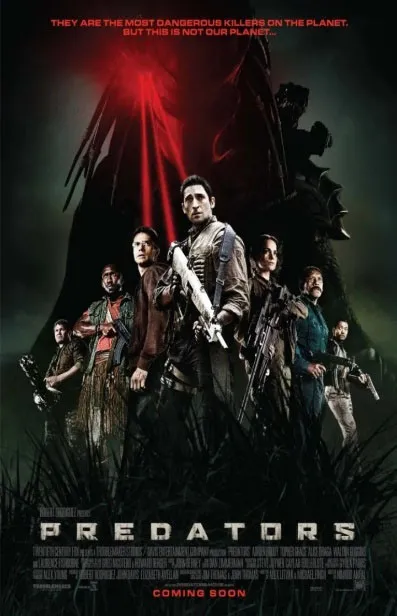 Movie poster showing seven armed people standing in a dark jungle with a large, shadowy alien figure behind them and red laser beams.