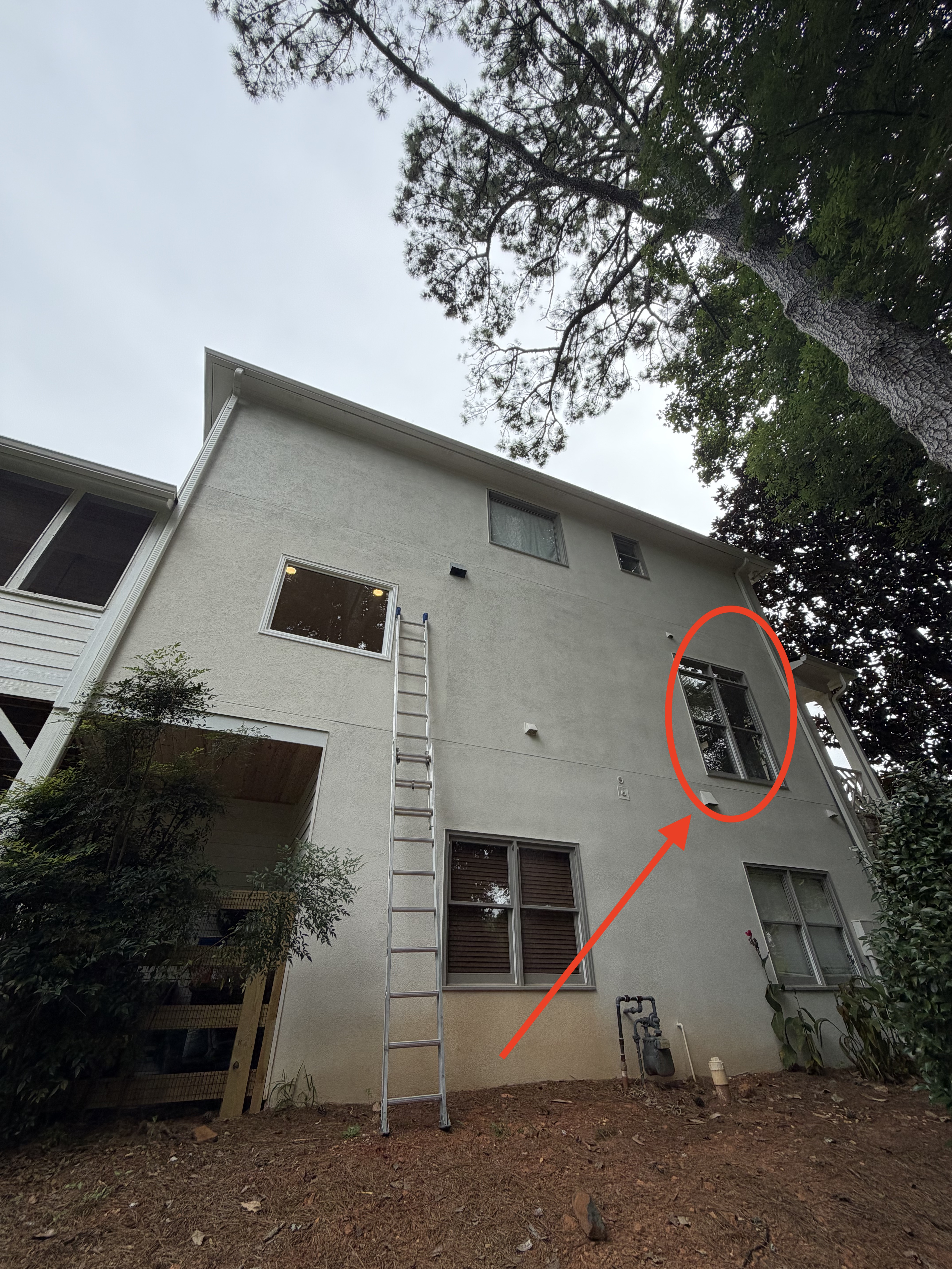 Upper window sitting cracked open, circled