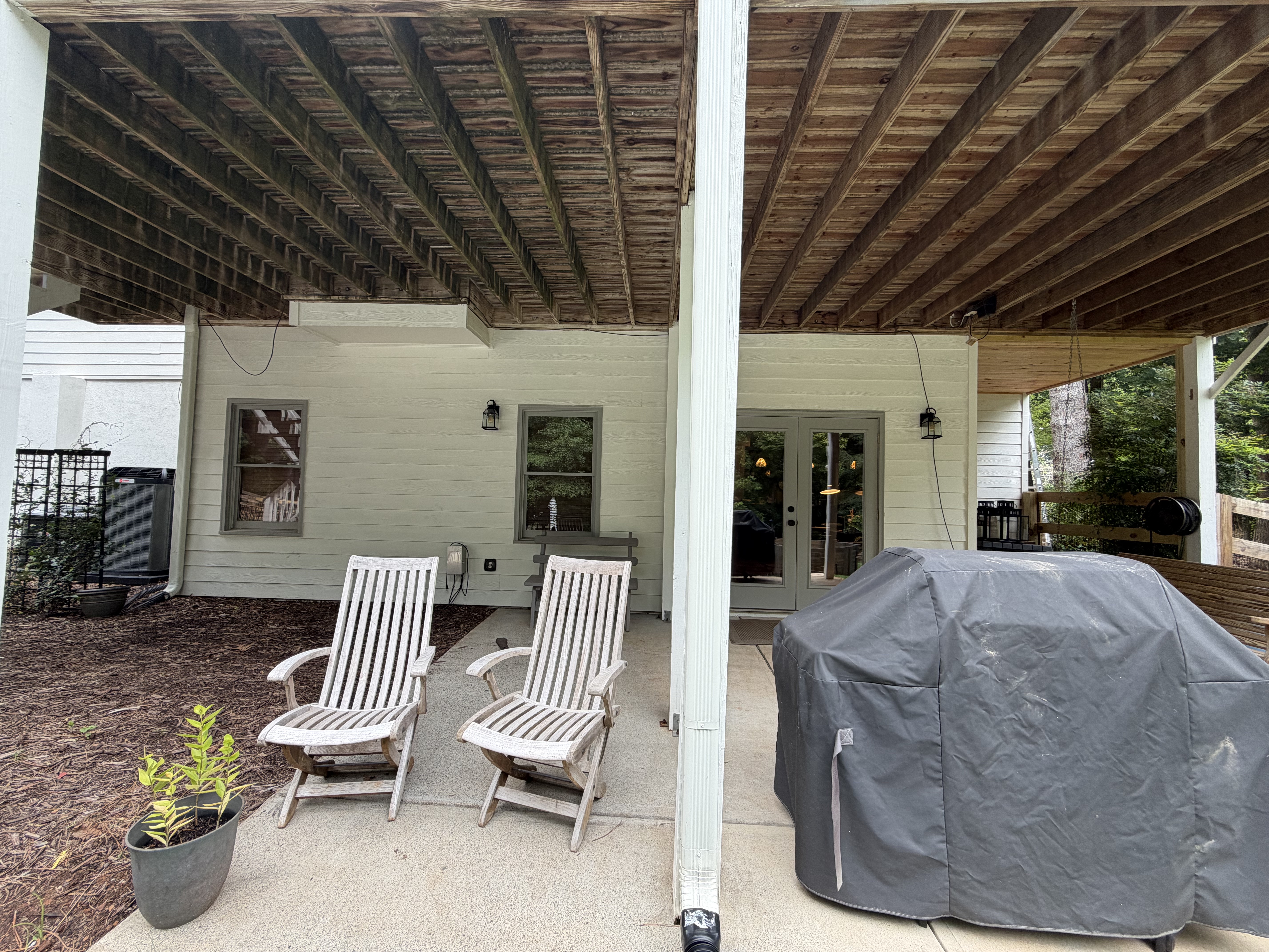 Wider view of the rear patio and the outlet location