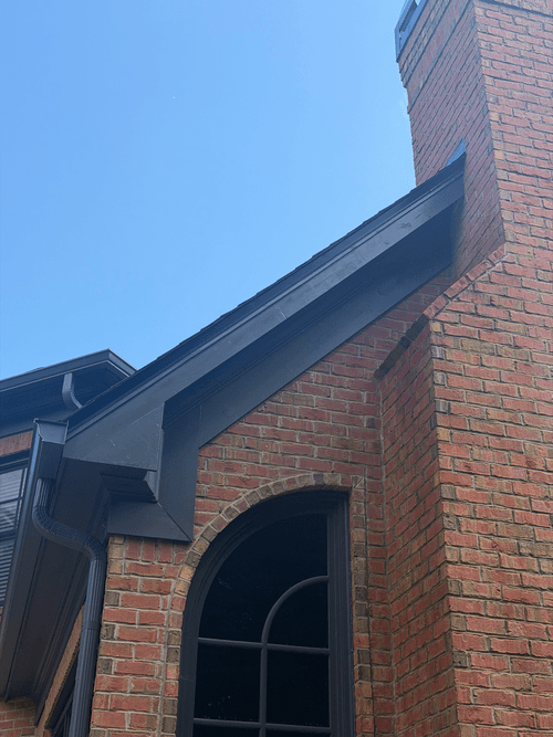 Chimney fascia boards sanded and repainted in matched exterior trim paint