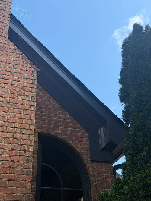 Repainted chimney fascia seen from the driveway side