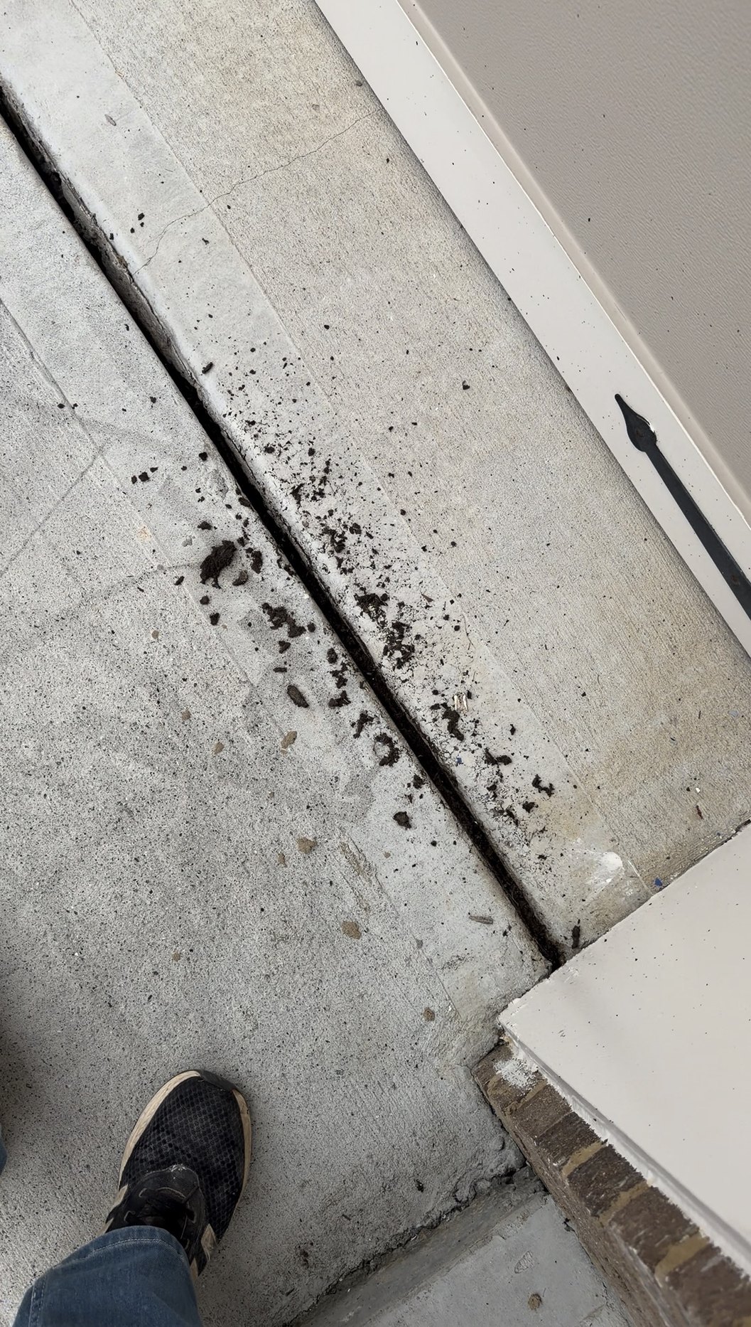 Soil dug out of the entry expansion joint before sealing
