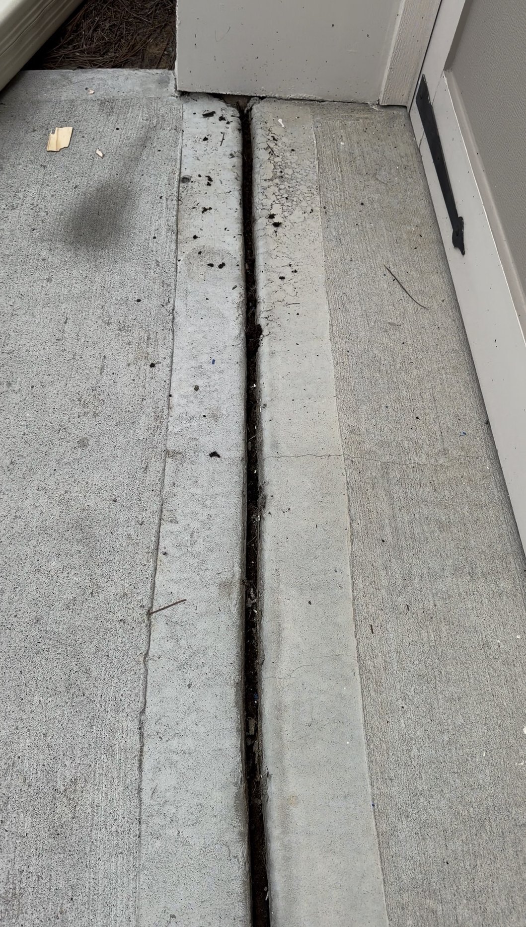 Expansion joint at the entry open and packed with soil before sealing
