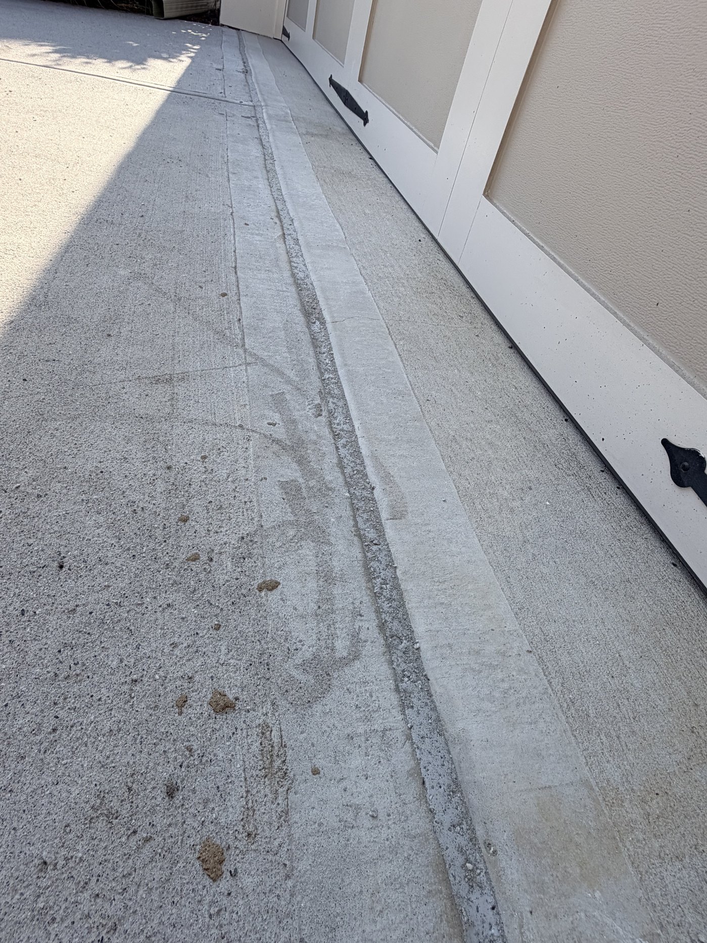 Entry expansion joint cleaned out and sealed against the house