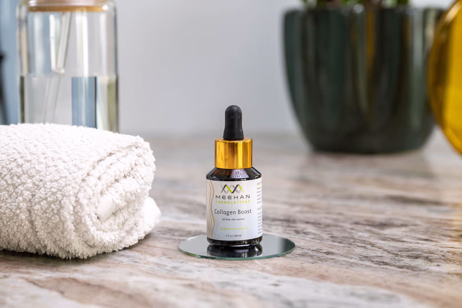 Meehan Formulations Collagen Boost serum bottle on marble from a product shoot