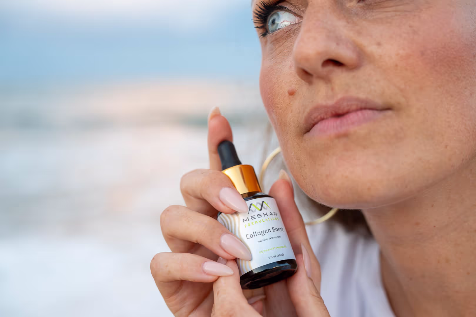 Creator holding a Meehan Formulations skin serum bottle near her face in a UGC beauty video
