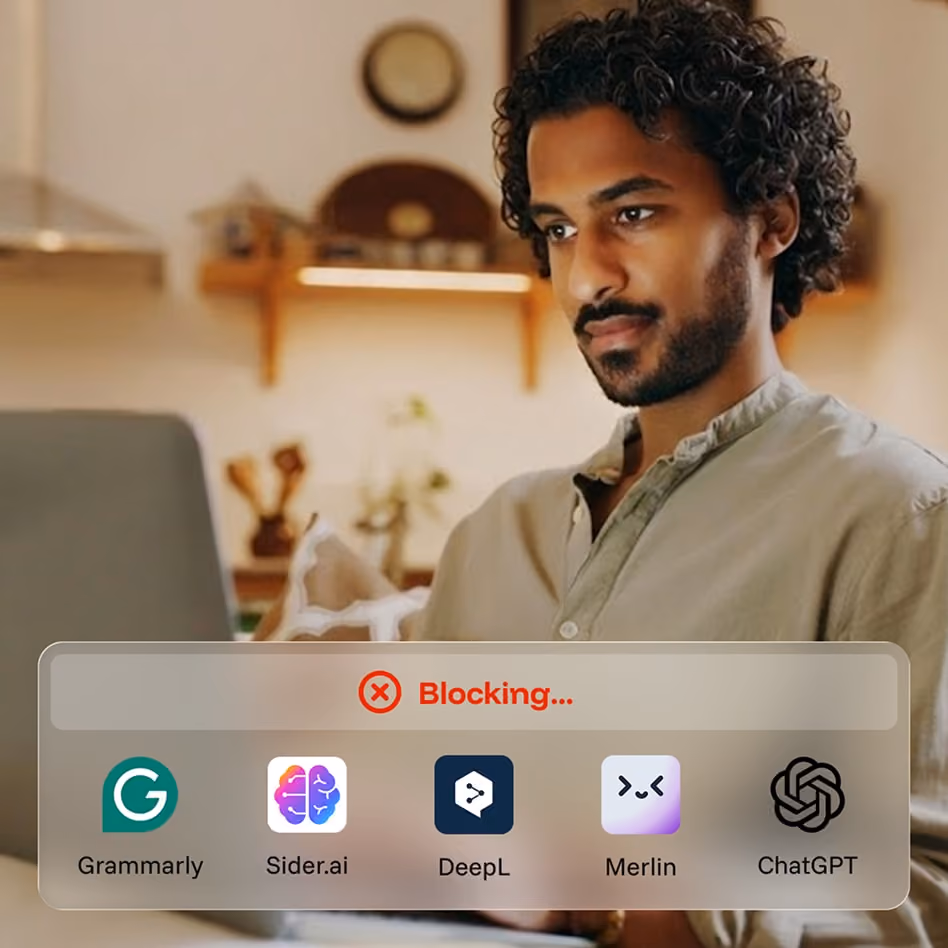 Man working on laptop with overlay showing blocking of Grammarly, Sider.ai, DeepL, Merlin, and ChatGPT apps.