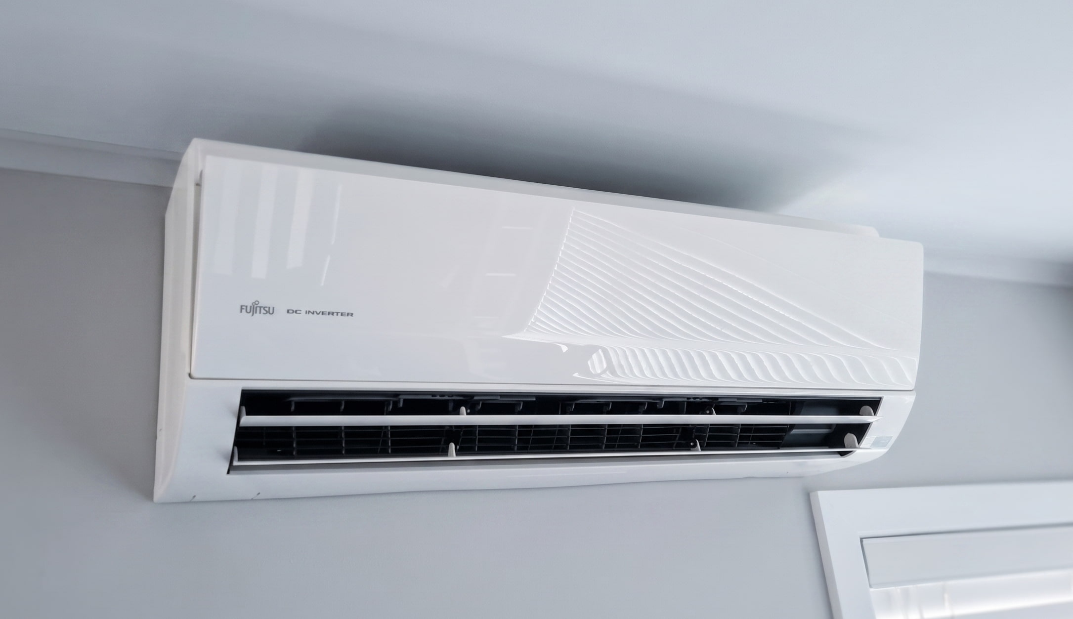 indoor heat pump unit on white wall