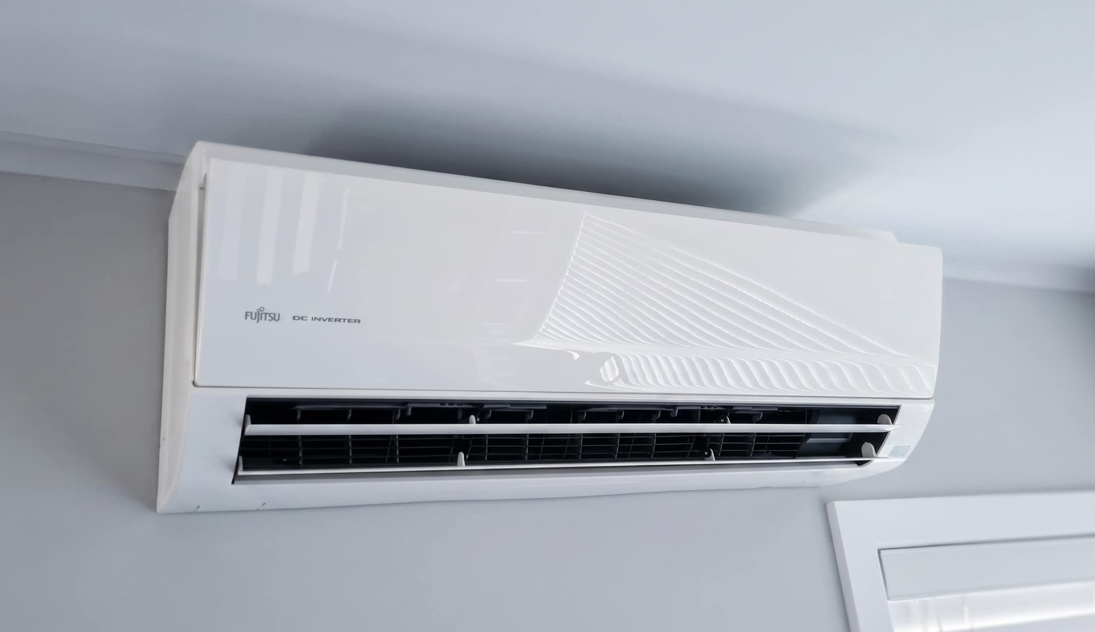 indoor heat pump unit on white wall