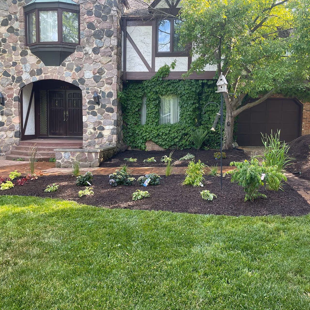 fresh mulch installation in landscape beds by Jeff's Lawn And Snow in Kenosha and Racine Counties Wisconsin