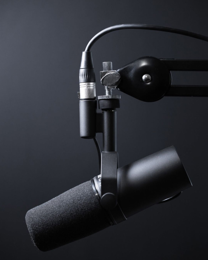 a close up of a microphone on a black background