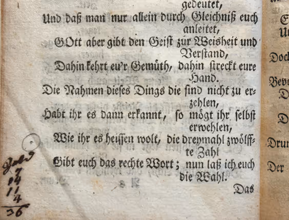 Close-up of an old German printed text in Fraktur script, with handwritten notations in the margin on aged paper.