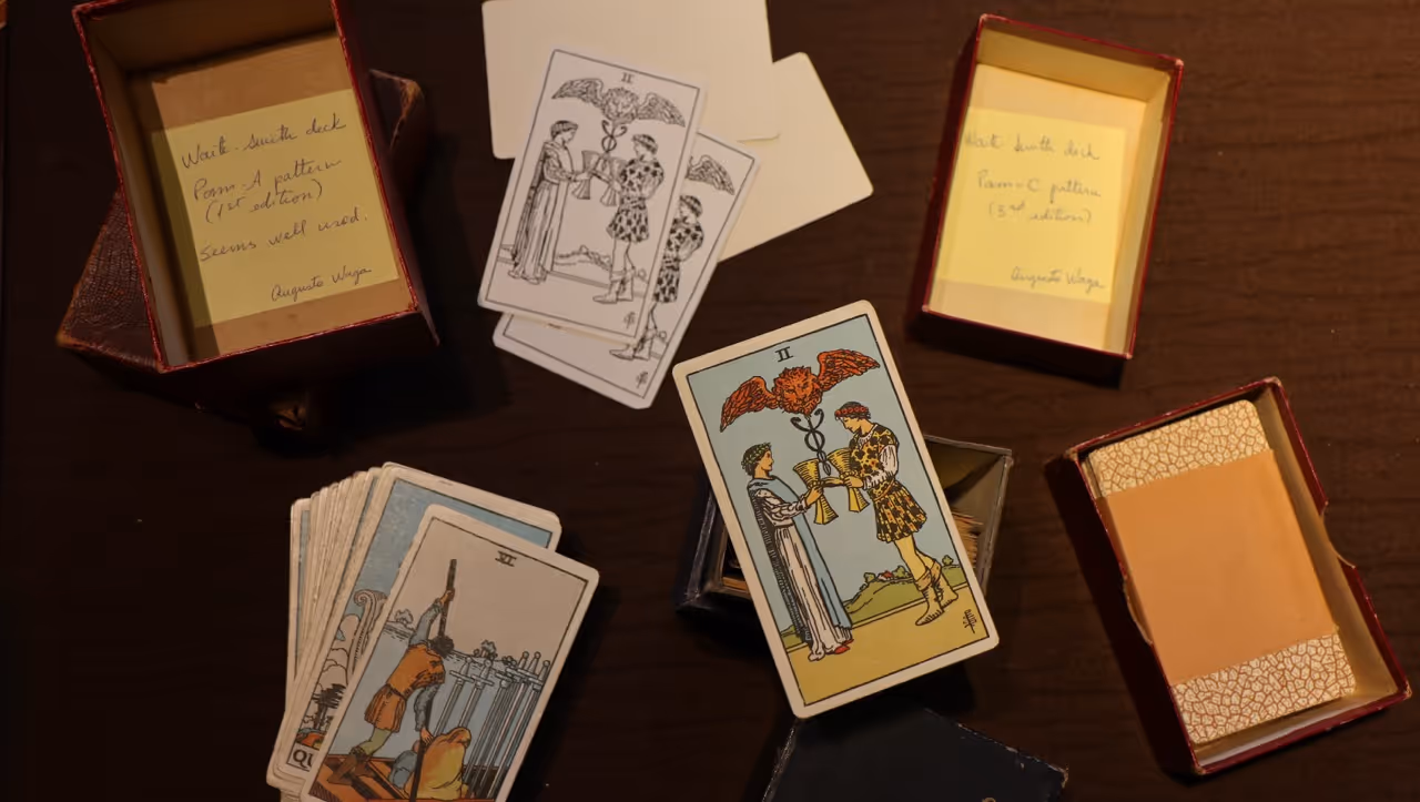 A first edition Rider-Waite-Smith tarot deck during Waga's research, highlighting the two of cups.