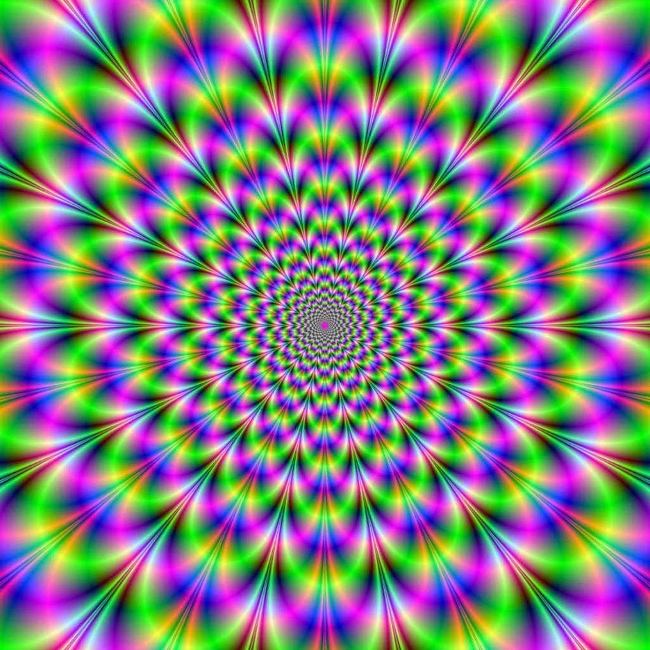 A vibrant, neon psychedelic pattern radiating outwards in concentric circles of bright green, pink, purple, and blue hues.