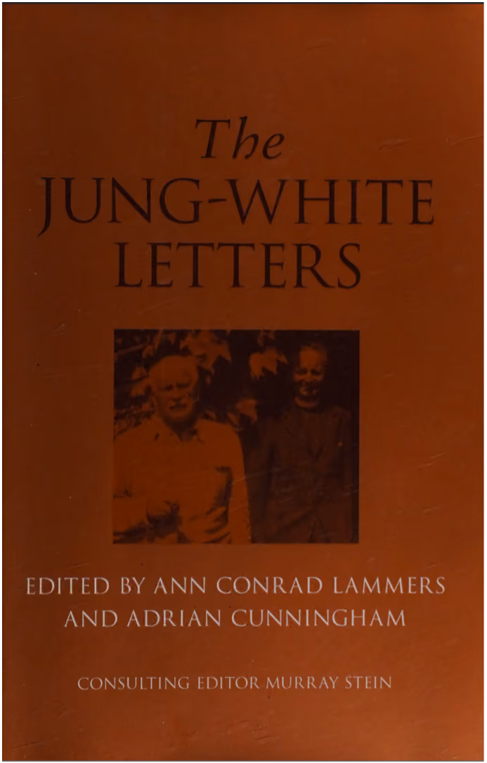 A brown book cover titled "The Jung-White Letters" featuring a dark, inset photograph of Carl Jung and Victor White.