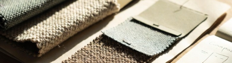 Woven fabric samples arranged on a material research board.