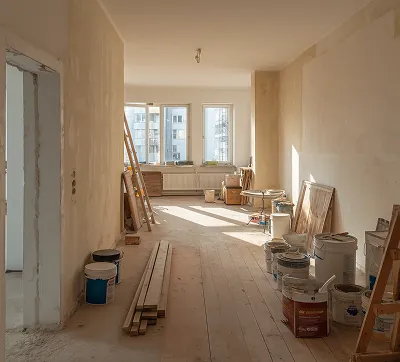 A room under construction with visible building materials, highlighting active project development and high-quality architectural execution.