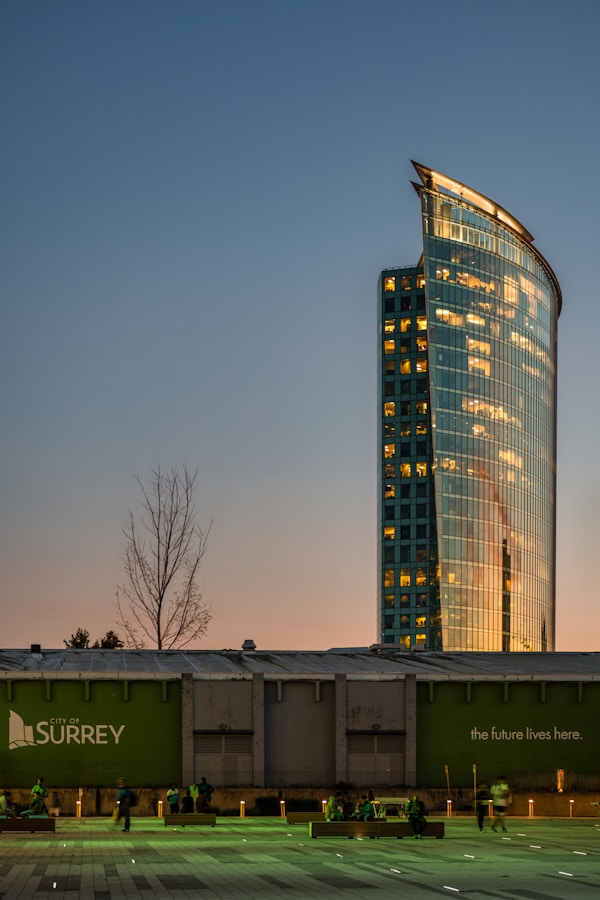 a very tall building sitting next to a parking lot