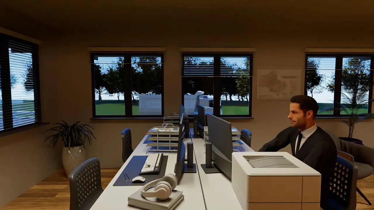 Büroumgebung mit einem Mann am Schreibtisch, mehreren Monitoren, einem Drucker, Kopfhörern und großen Fenstern mit Blick auf Bäume.