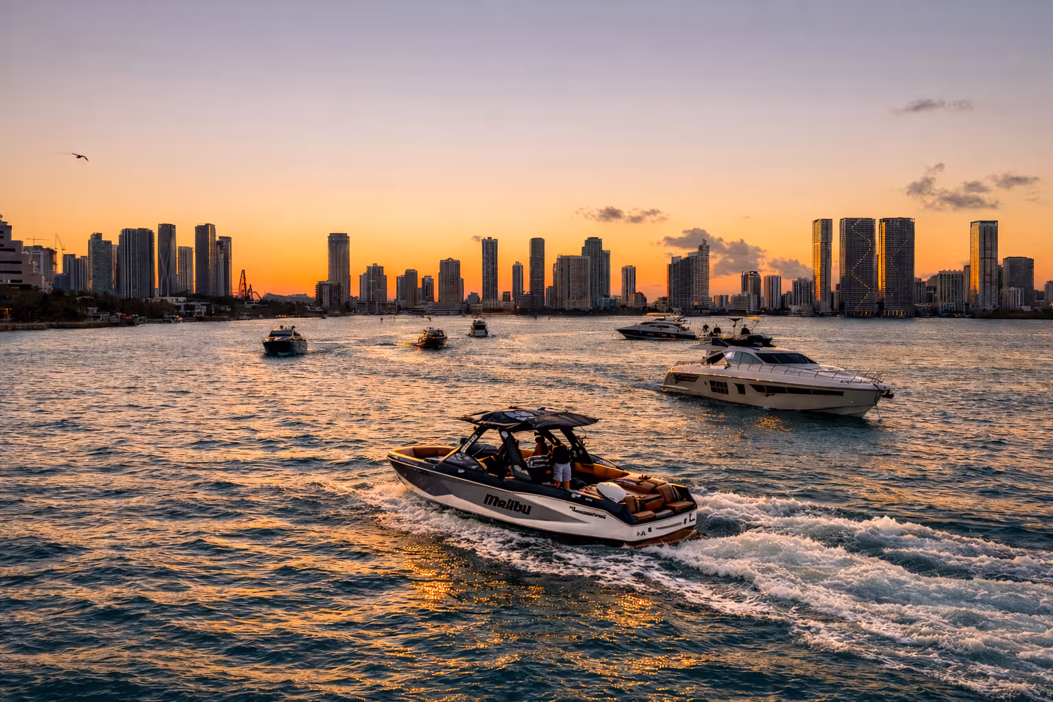Woman driving a sailboat in Barcelona on a sunny day