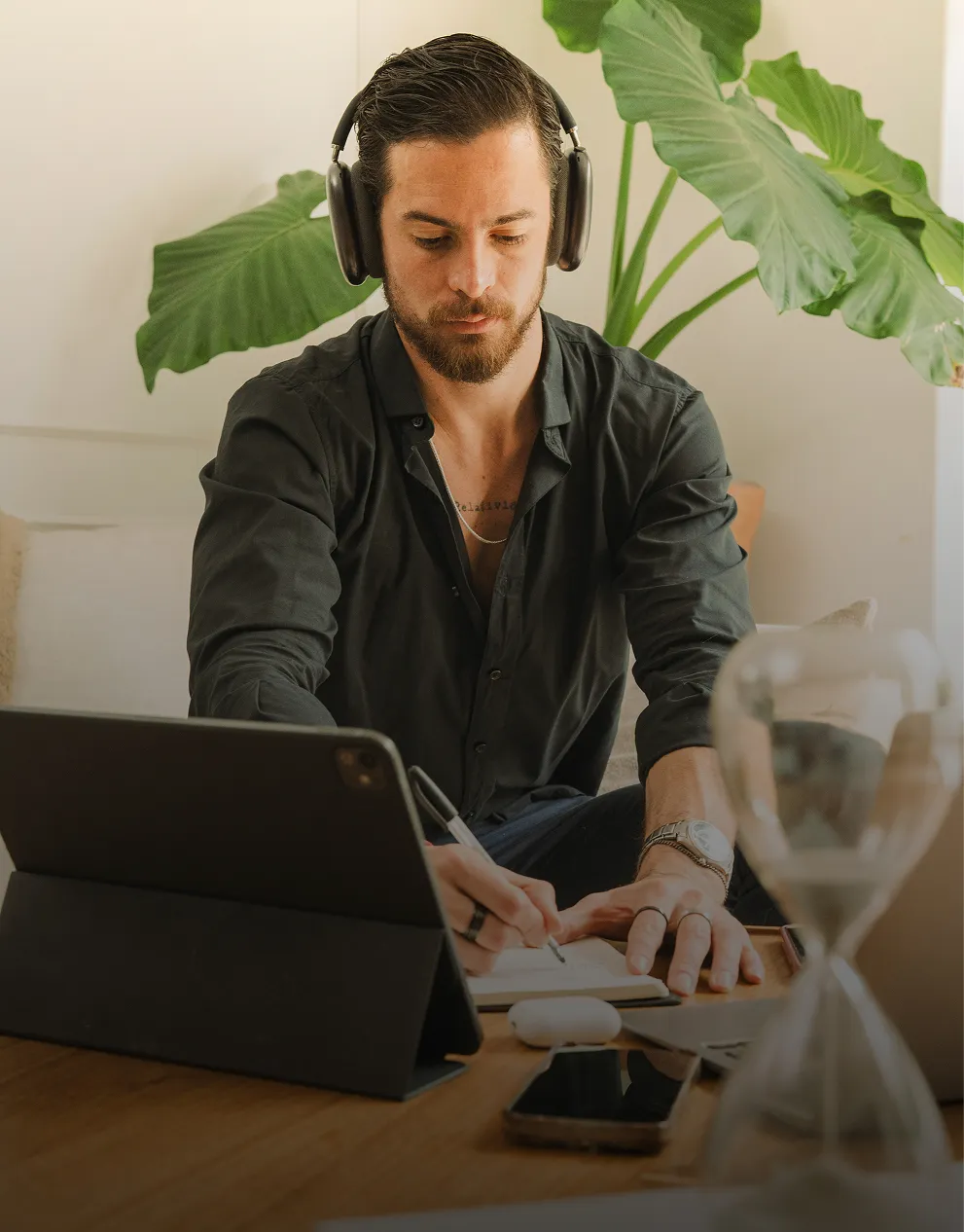 Two people sitting at a wooden table smiling and eating healthy meals with bread and lemon water, with text overlay 'Built around you. Nutrition Plans.'