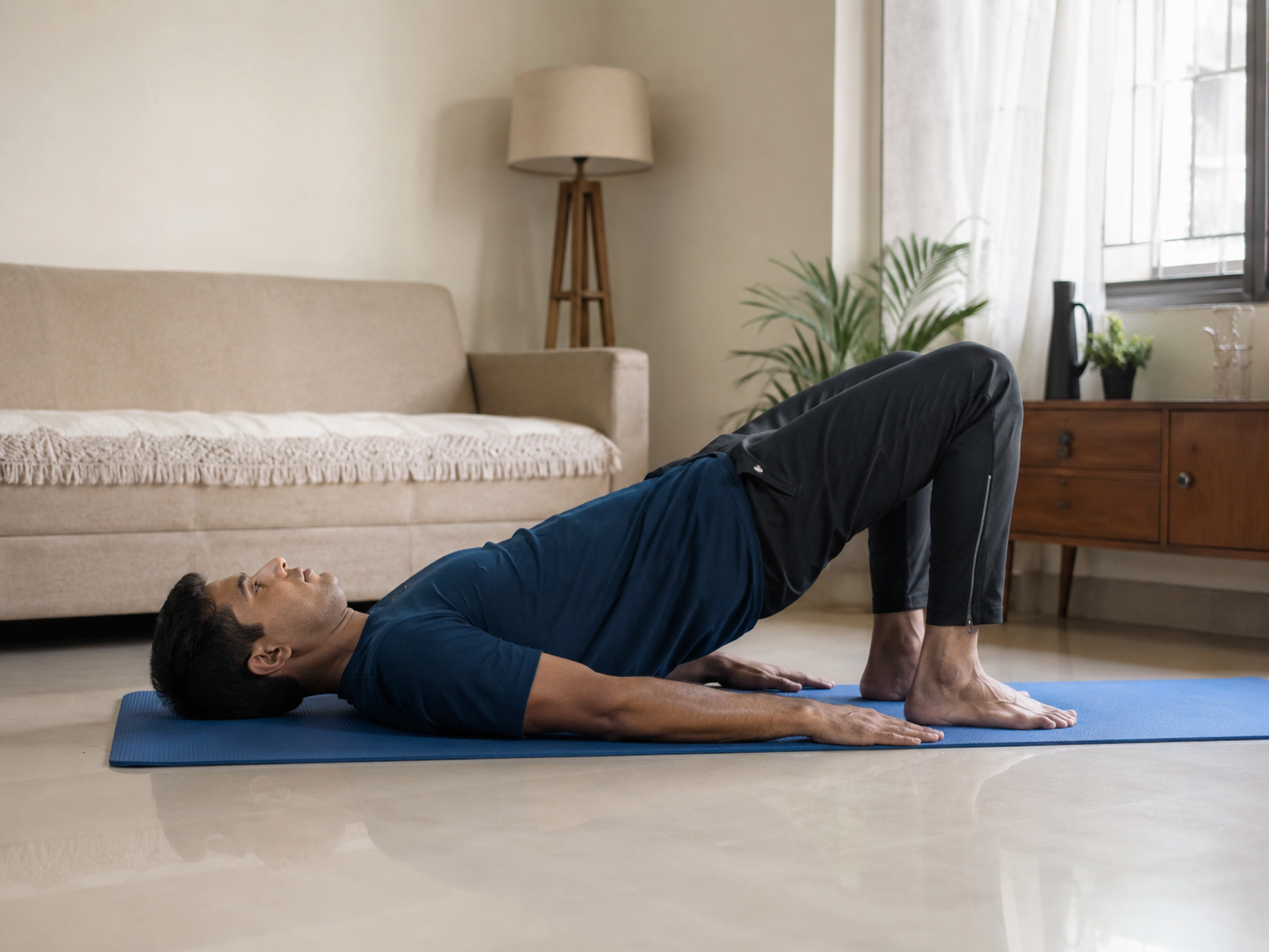 A person doing a gentle back-strengthening exercise on a mat at home.