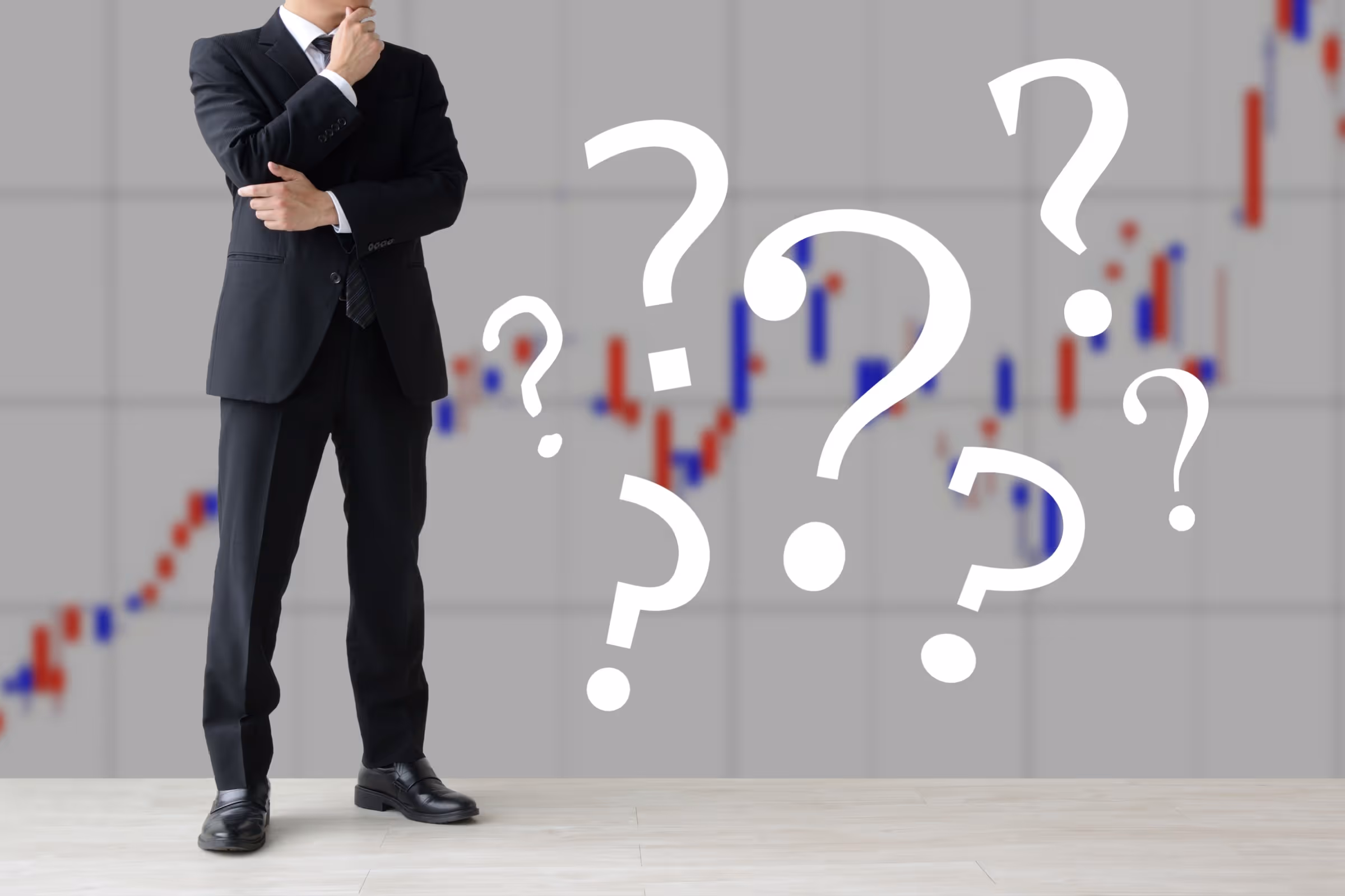 trader standing in front of a stock chart with question marks representing uncertainty in trading