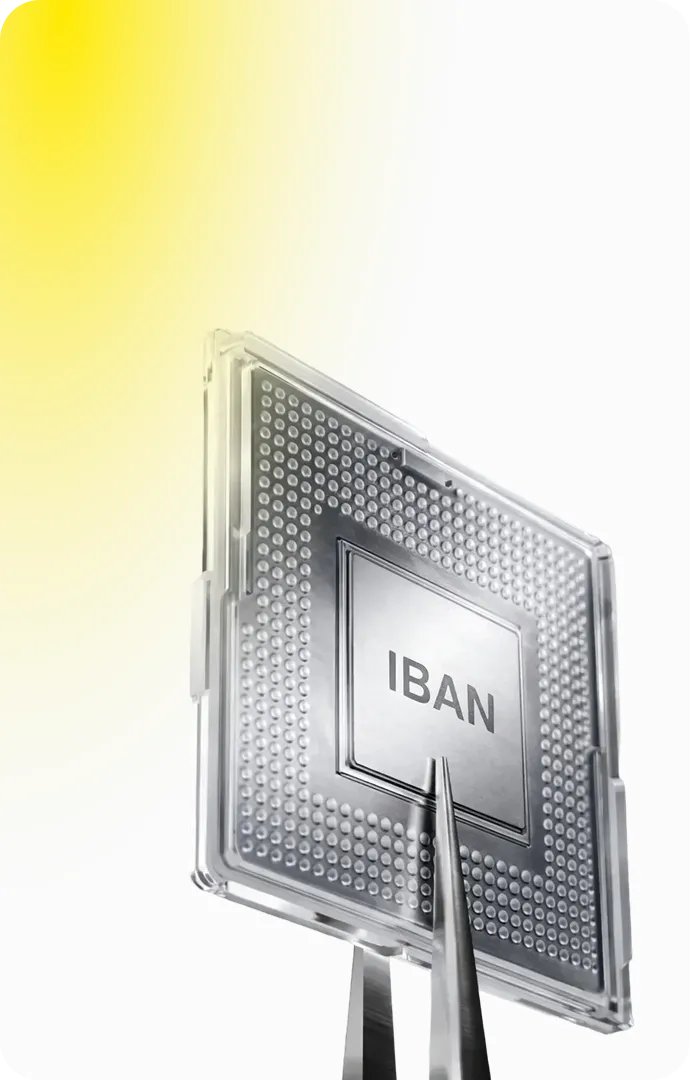 Transparent microchip labeled 'IBAN' held by tweezers against a white background with a yellow gradient.