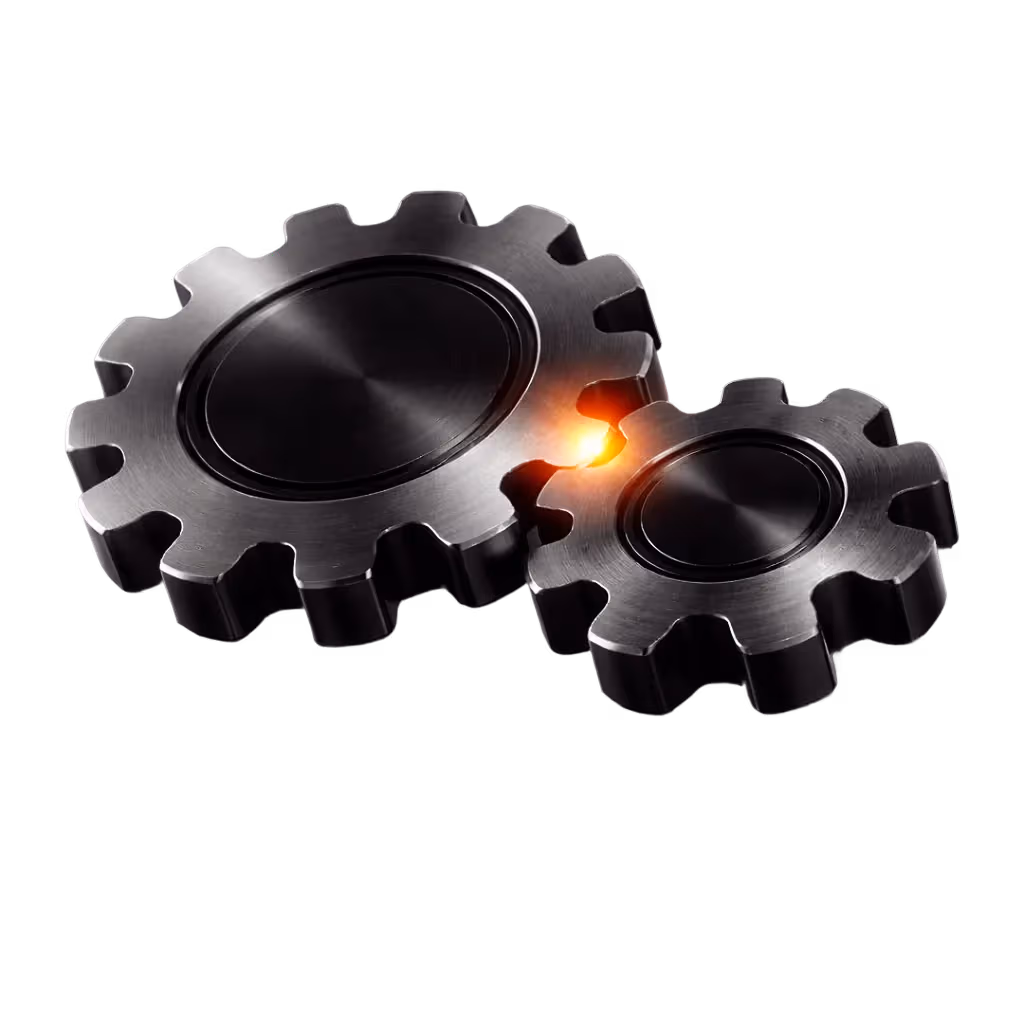 Zwei ineinandergreifende metallische Zahnräder mit einem leuchtenden orangefarbenen Licht zwischen den Zähnen.