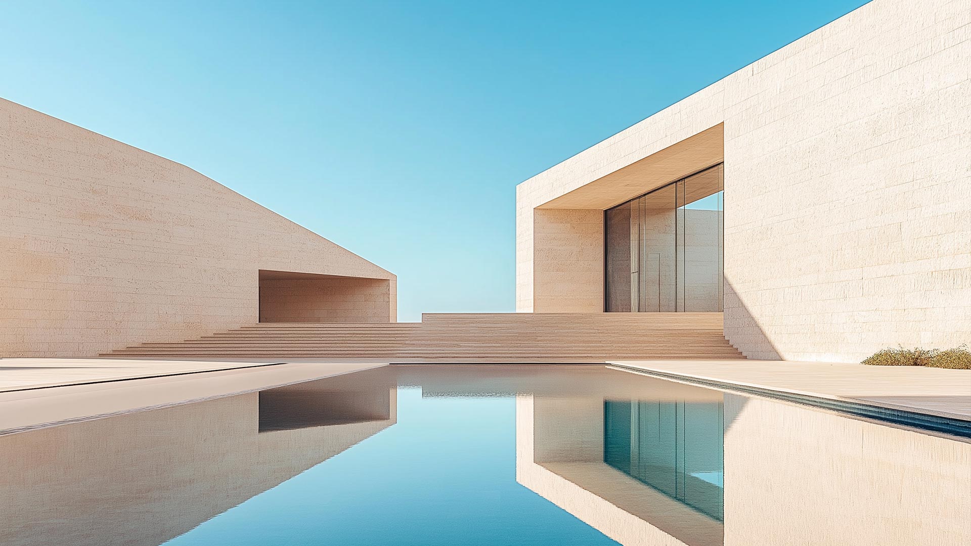 Geometric building with pool on clear sky background.