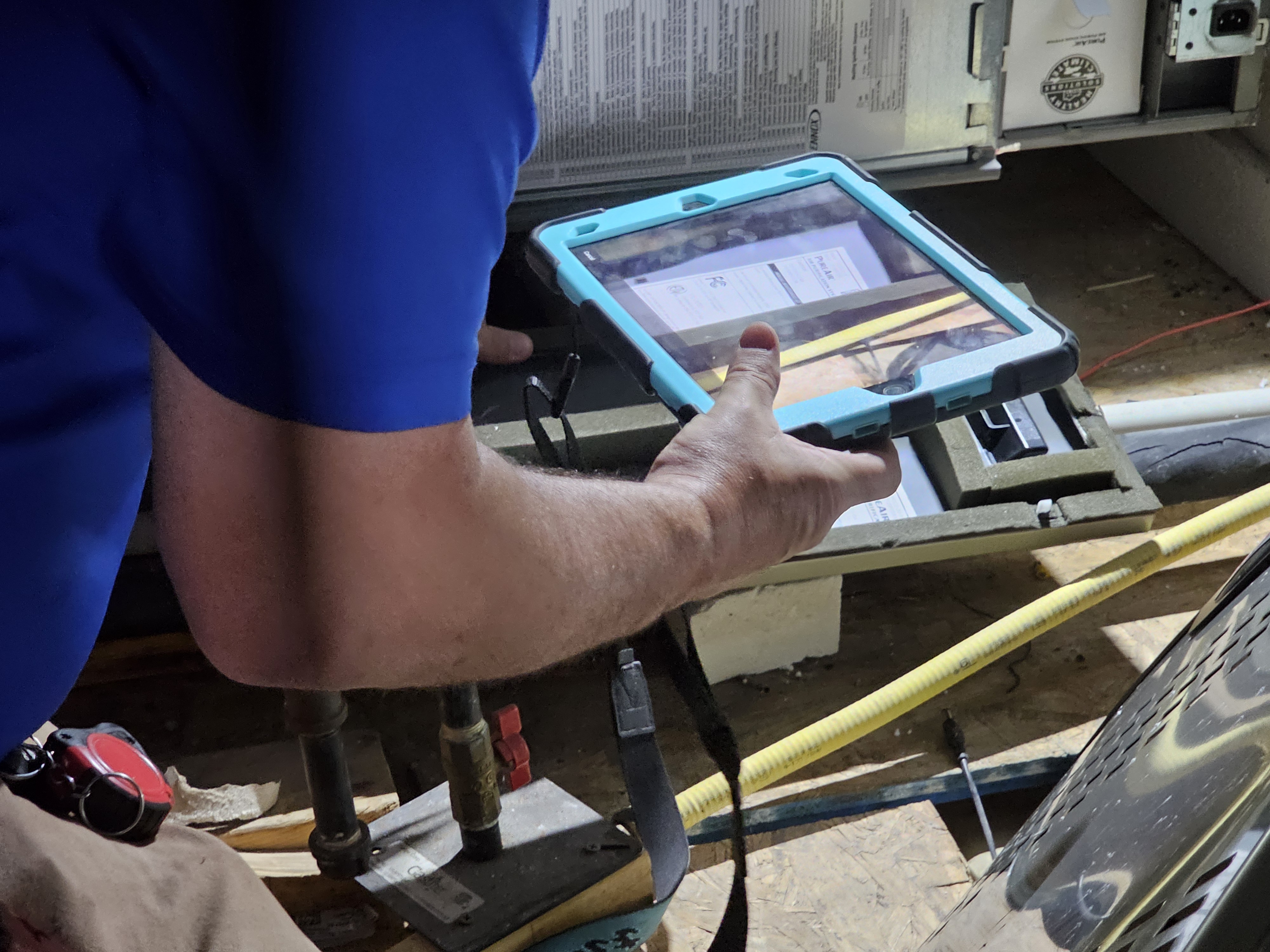 Kinsey heating technician repairing furnace in Georgetown TX