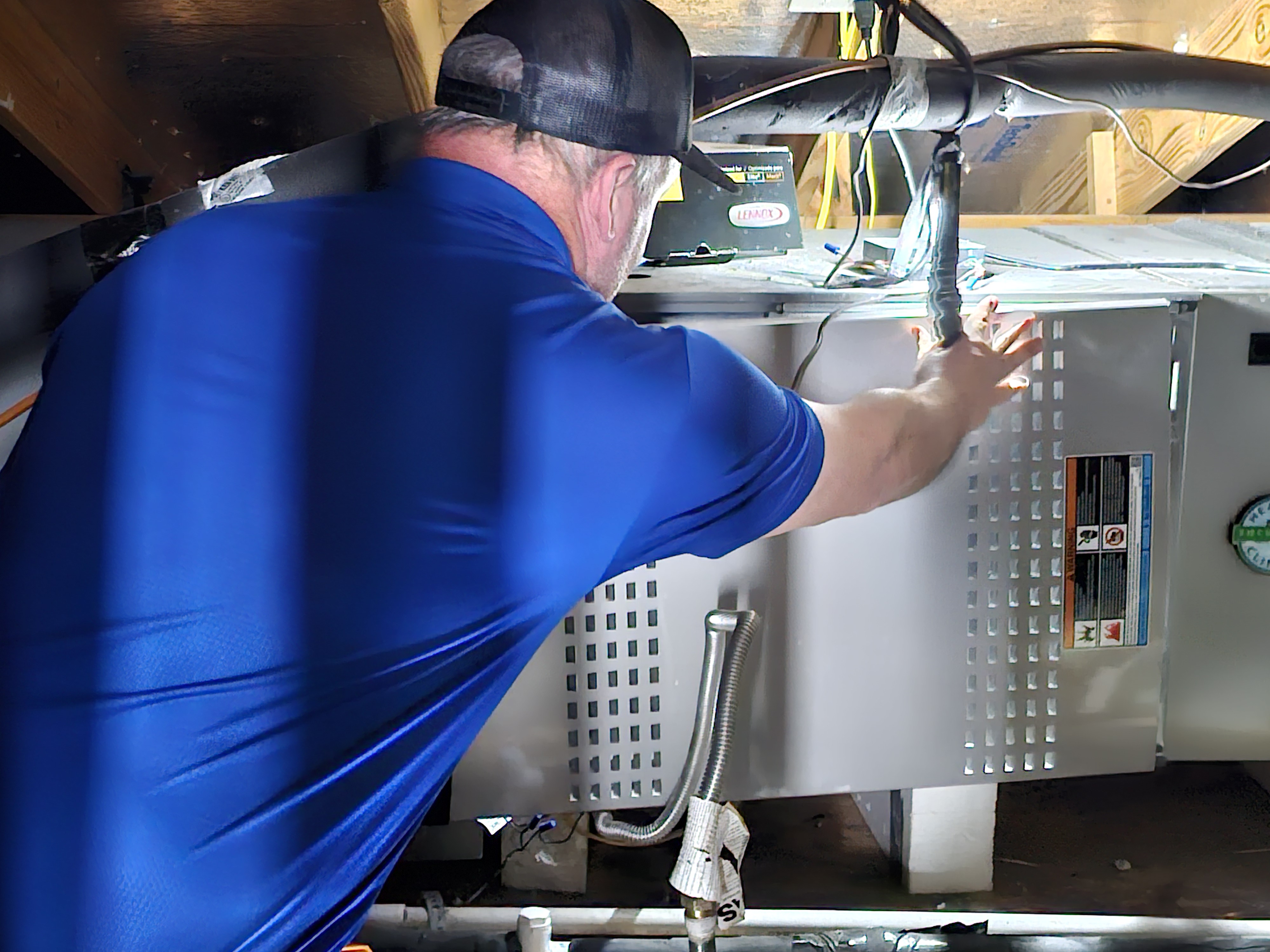 Kinsey technician on a air conditioning repair job in Austin, TX