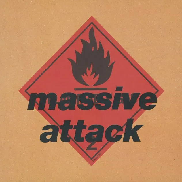 Red diamond-shaped flammable hazard sign with a black flame icon and the words 'massive attack' in bold black text overlay.