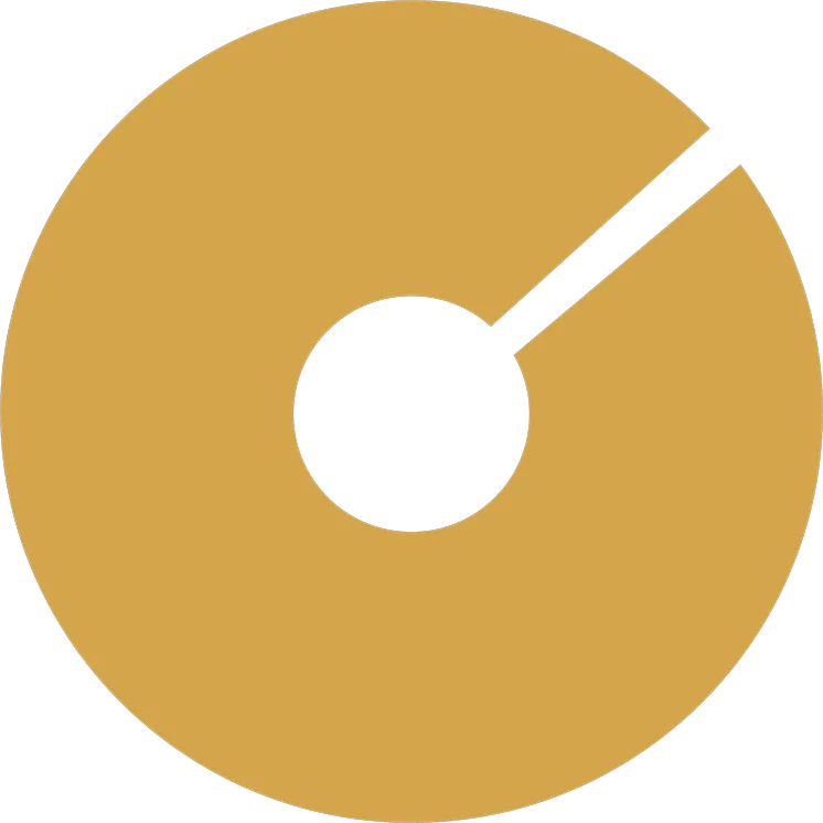Golden circular shape with a small central hole and a single angular cut extending from the center to the edge.
