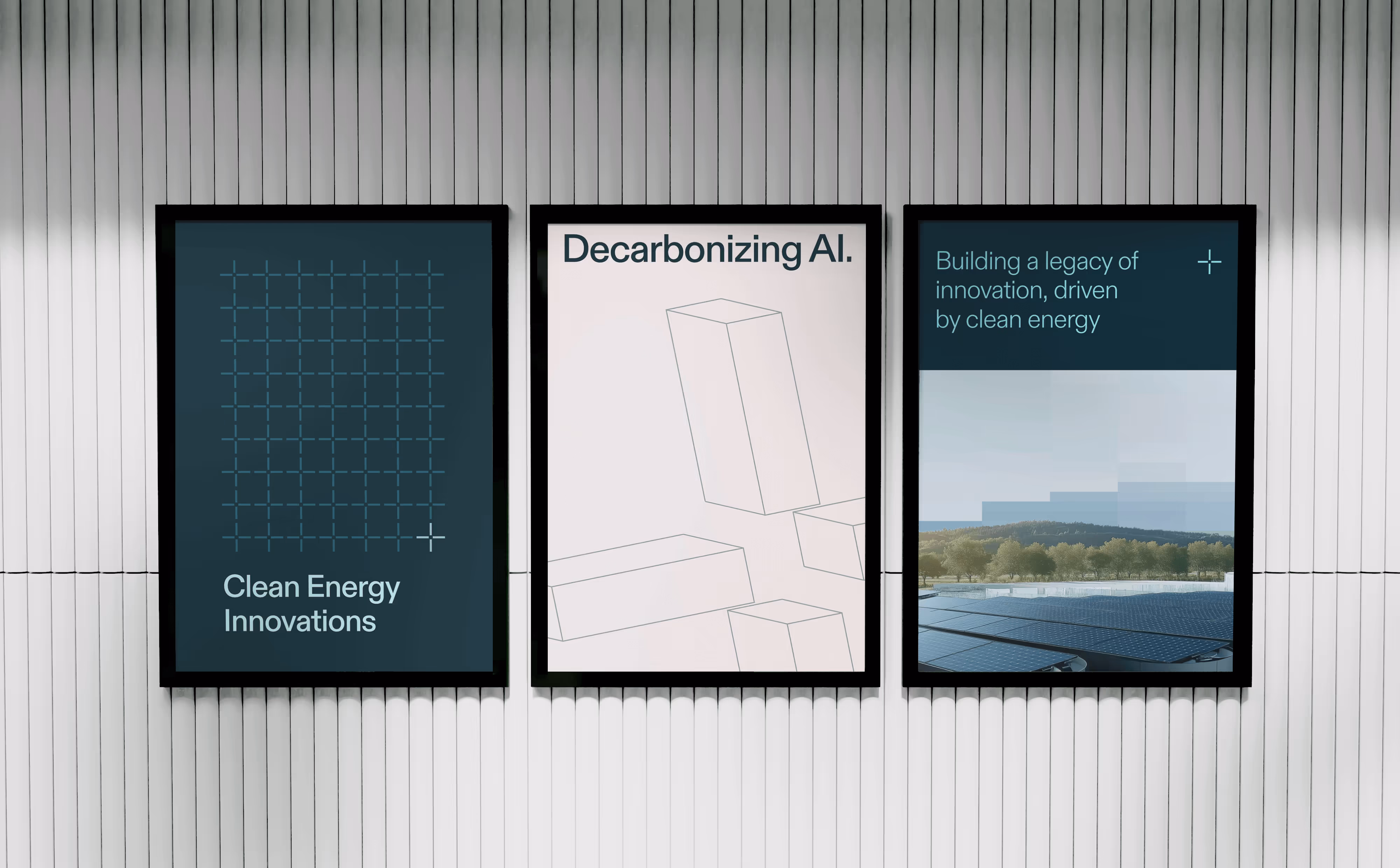 Three framed posters on a white slatted wall featuring "The Be Company" slogans for clean energy and decarbonizing AI. 