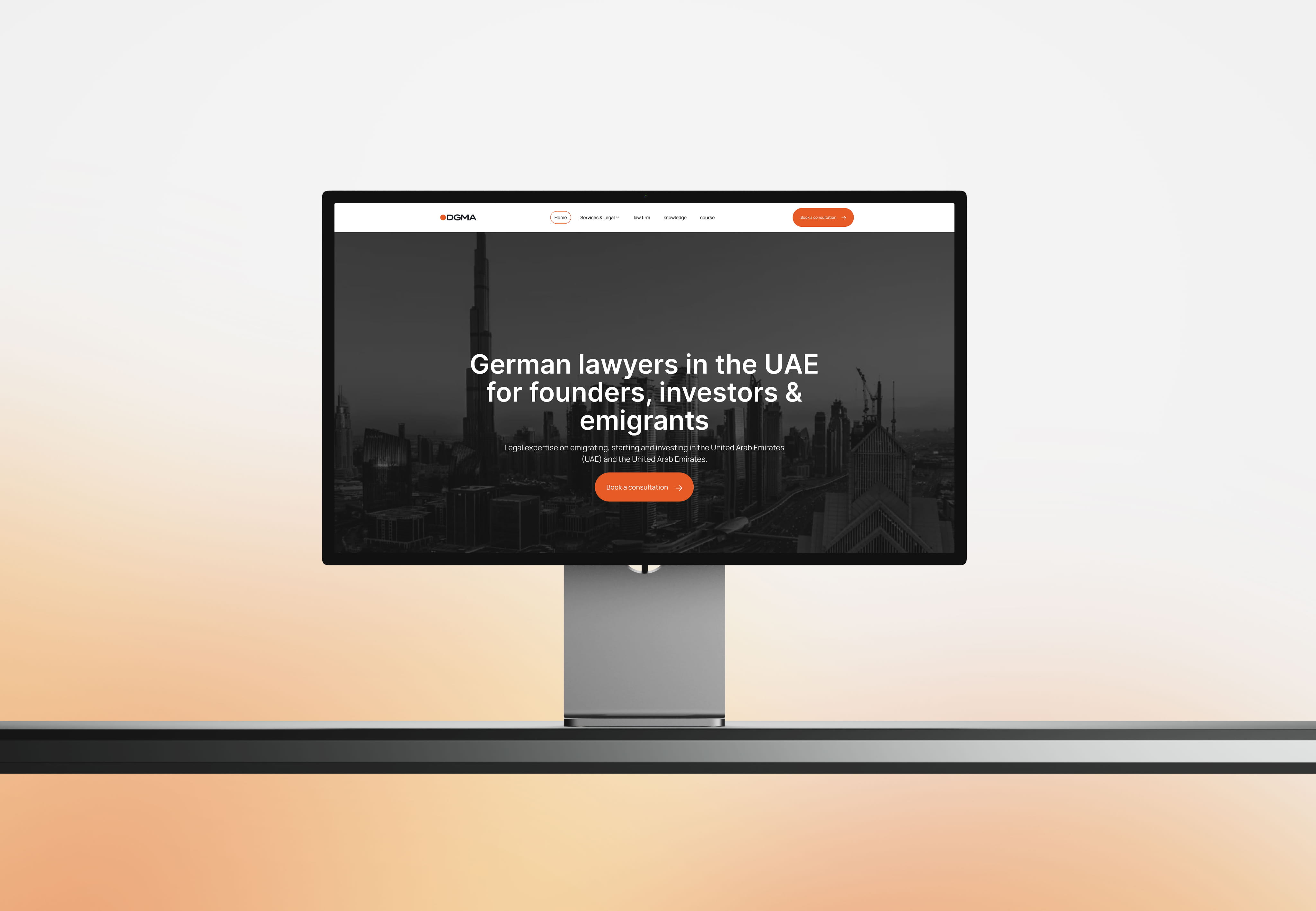 A desktop monitor displaying the DGMA homepage, featuring a grayscale skyline of Dubai and the headline "German lawyers in the UAE for founders, investors & emigrants." 