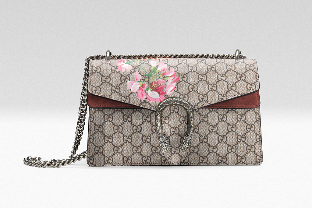 Gucci Dionysus shoulder bag featuring the GG monogram canvas, floral detailing, silver chain strap, and signature tiger head clasp.