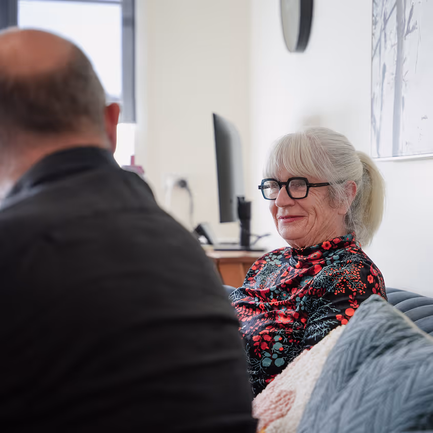 a woman sitting on a couch
