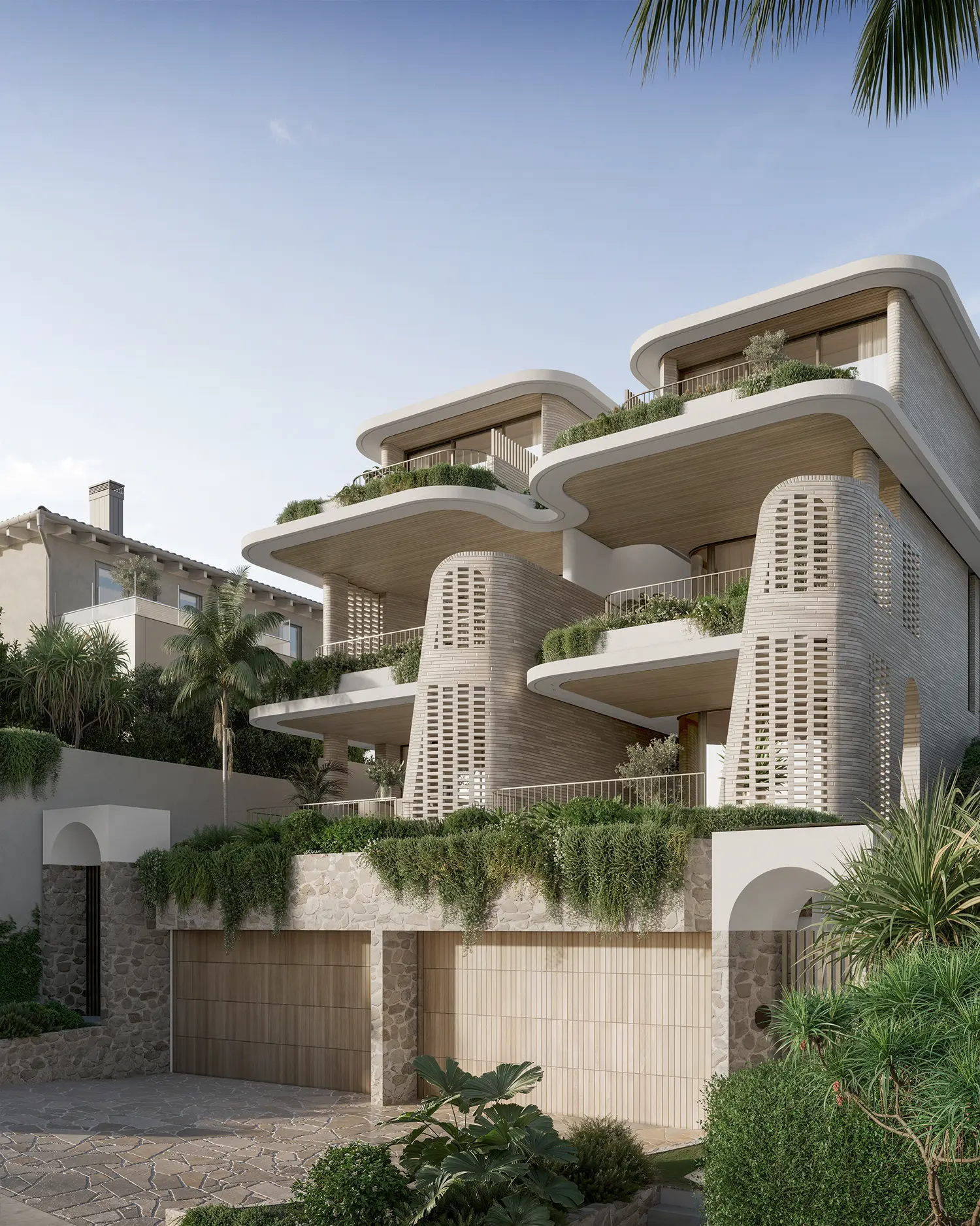 Modern multi-story house with curved balconies, lush greenery, stone and wood accents, and large garage doors.