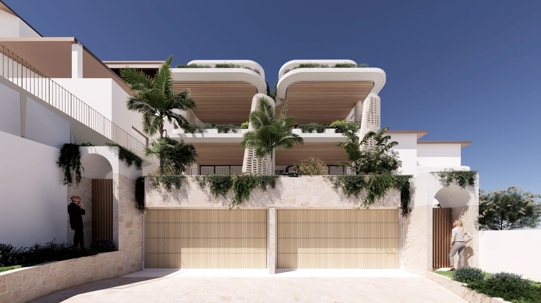 Modern two-story house with stone walls, wooden garage doors, lush greenery, and palm trees under a clear blue sky.