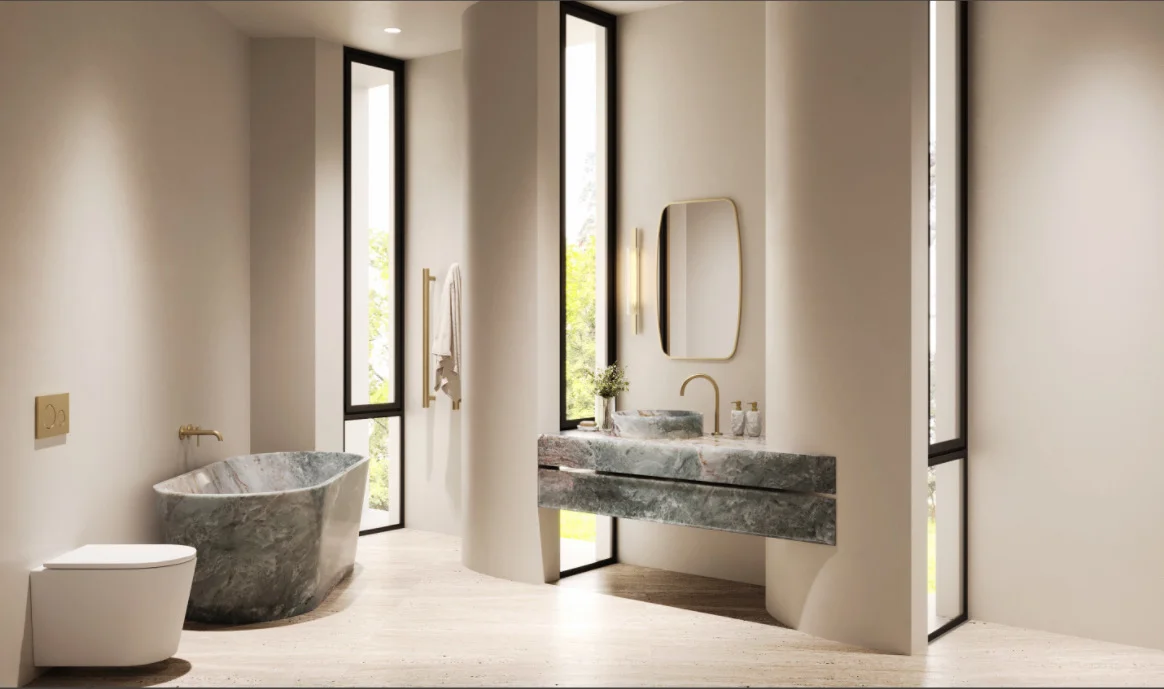 Modern minimalist bathroom with gray marble bathtub and sink, gold fixtures, tall narrow windows, and light wood flooring.