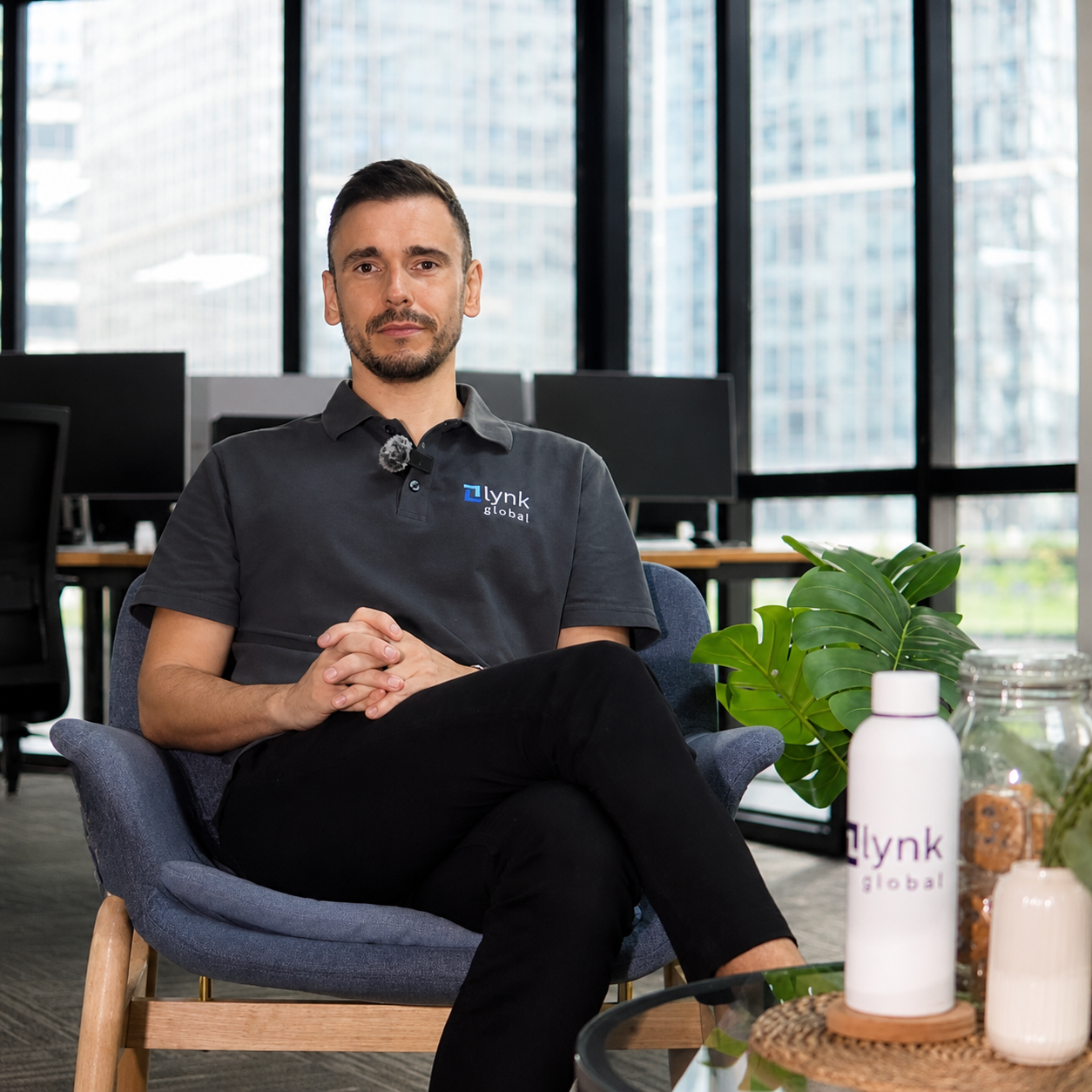 Lynk Global founder Daniel seated in the company’s modern office in Manila, Philippines.