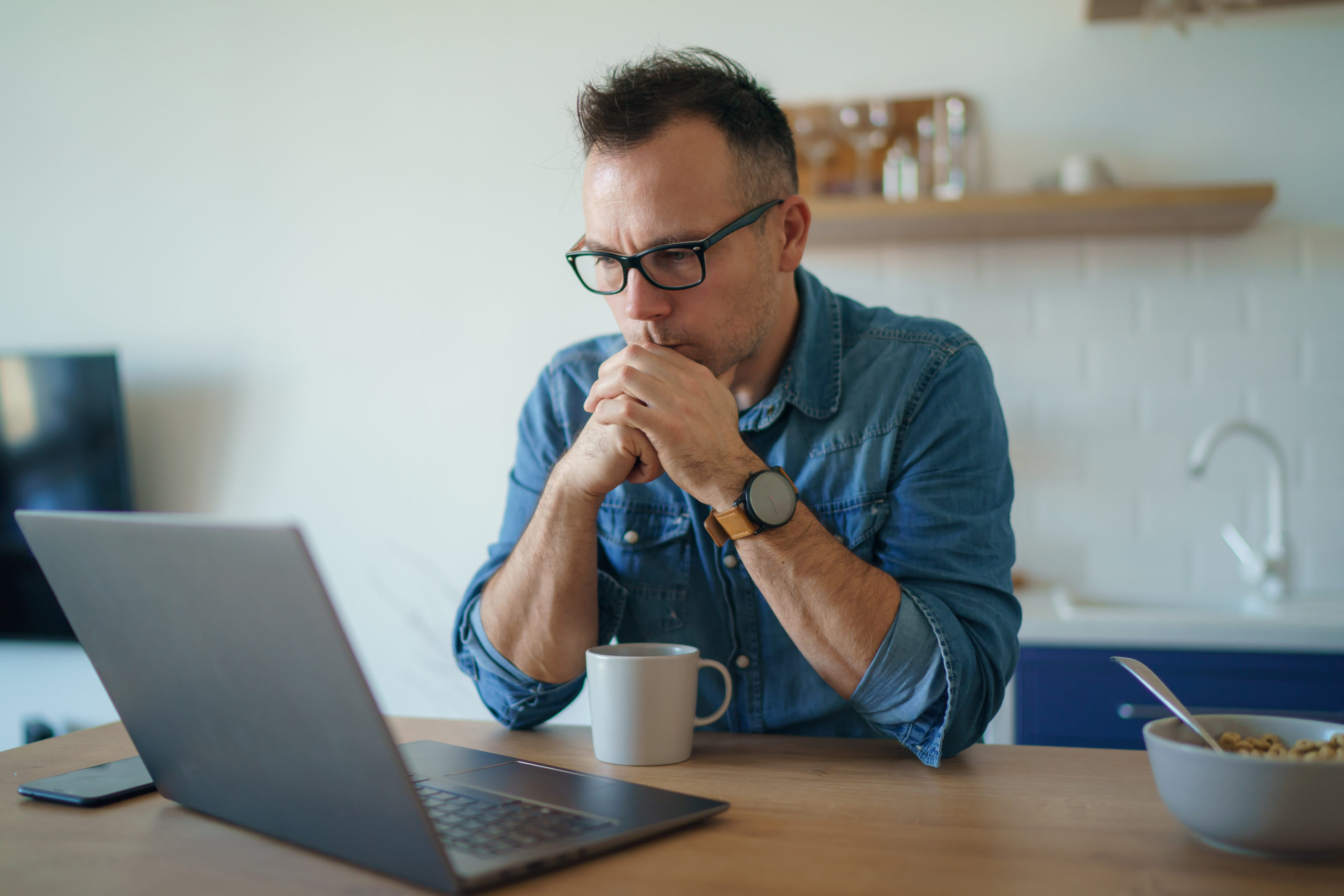 man wearing a blue denim - Profitable Gold Trading Strategy