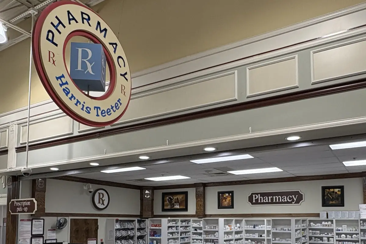 Pharmacy counter signage inside Harris Teeter Pharmacy at Rosedale Shopping Center